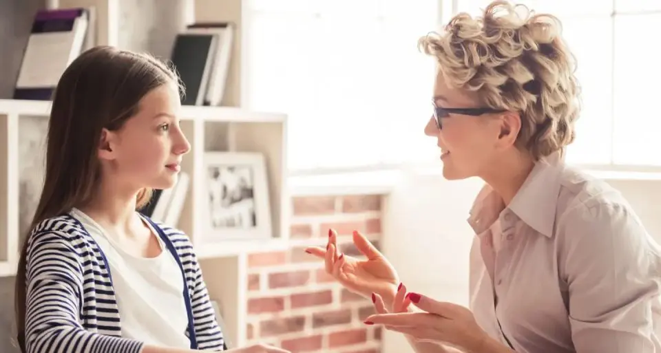 Teacher and student discussing together